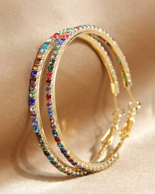 Colorful rhinestones embedded on golden hoop earring. 3 cms diameter